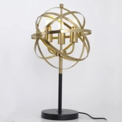 Lampe De Table Métal Doré Et Pied Noir Nostra -Philips Boutique lampe de table metal dore et pied noir astron 3327480055168 532589